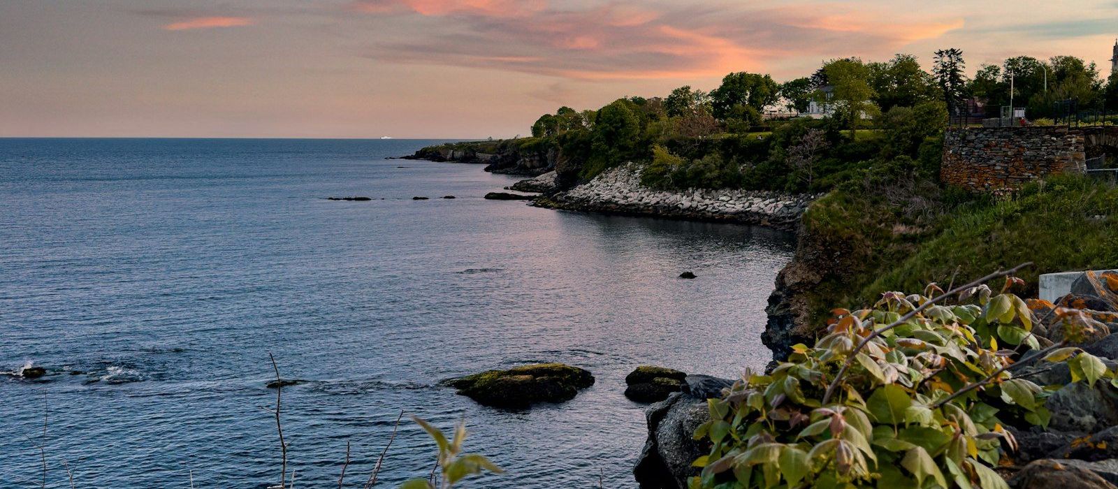 Rocky Rhode Island shoreline at sunset